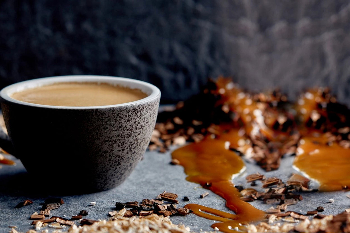 a close up of a cup of Ola coffee on a table 